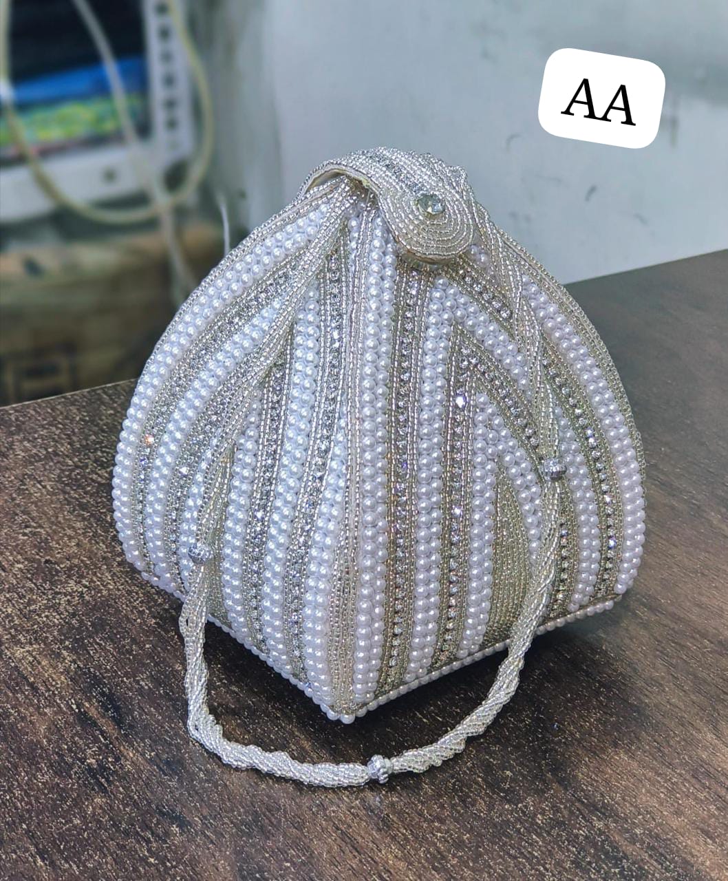 IMG-20260407-WA0117 Treditional Bridal wedding pearl Potli Handbag - Image 1